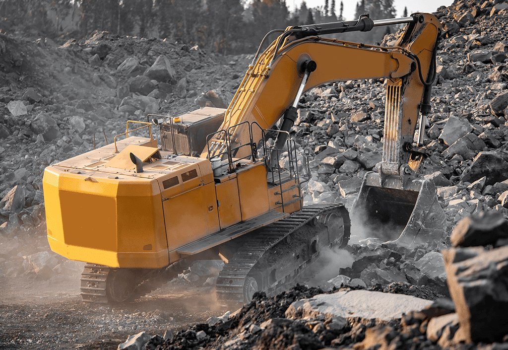 Excavator moving rocks